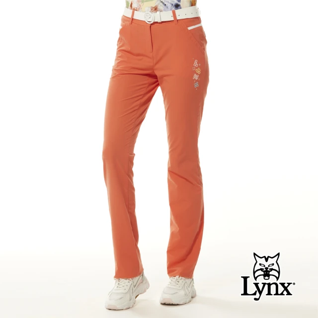 【Lynx Golf】女款彈性舒適Lynx魔術方塊繡花拉鍊口袋配色透氣織帶剪接造型窄管長褲(橘色)