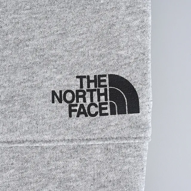 【The North Face】燙印LOGO慢跑長褲(亮灰x黑/男款)