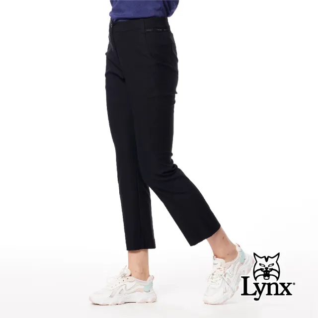 【Lynx Golf】女款彈性舒適後口袋繡花造型LOGO夜光織帶設計靴型九分褲(二色)