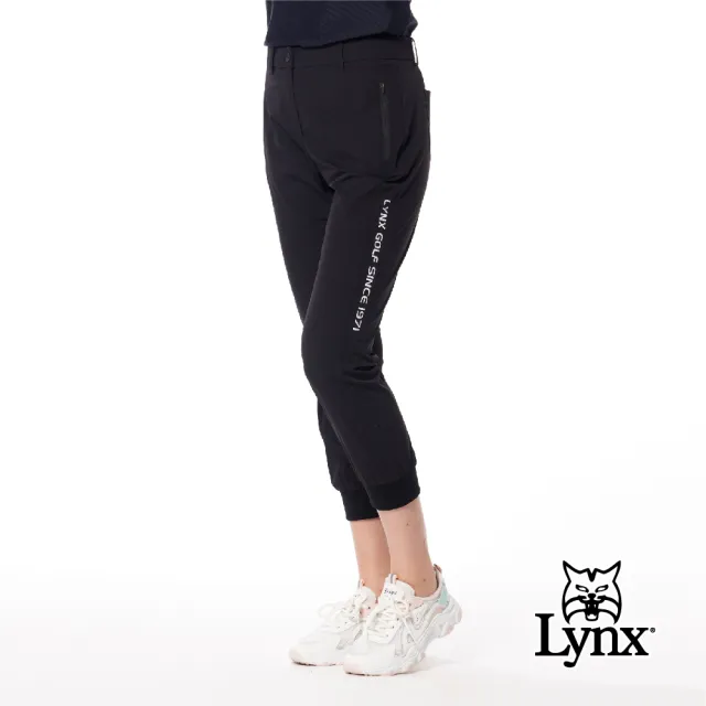 【Lynx Golf】首爾高桿風格！女款彈性舒適素面LOGO織帶剪接設計拉鍊口袋羅紋縮口窄管九分褲(二色)