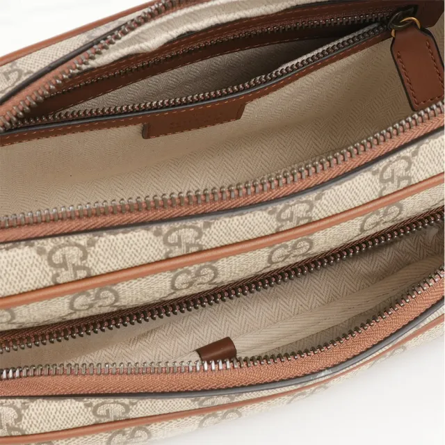 【GUCCI 古馳】GG Emblem 中款前口袋拉鍊斜背包(烏木/深棕色)