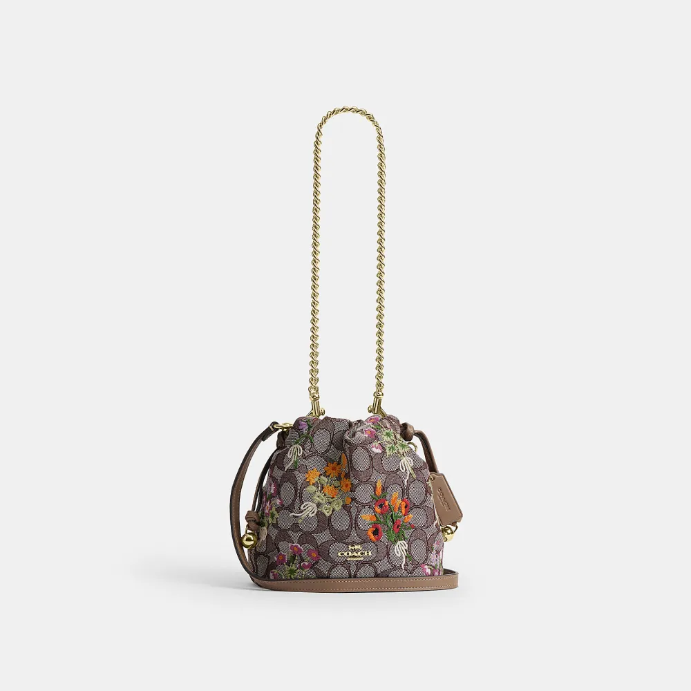 【COACH】蔻馳官方直營 FAYE 迷你花卉刺繡單肩手袋 肩背包 拉繩包(CDZ94)